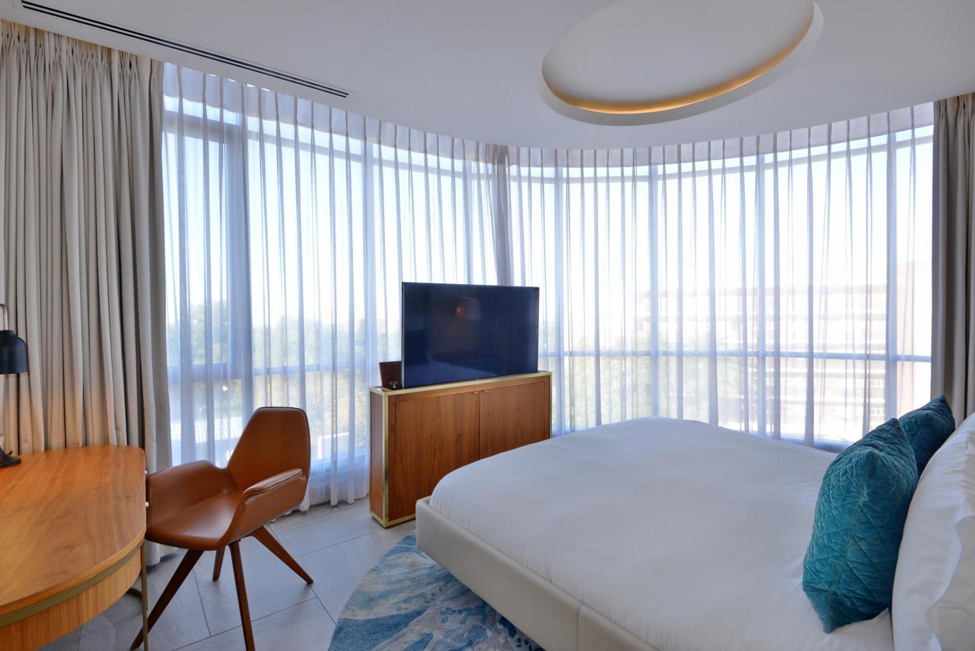 The Houghton Hotel, Spa, Wellness & Golf Johannesburg Pokoj fotografie A bedroom at the hotel